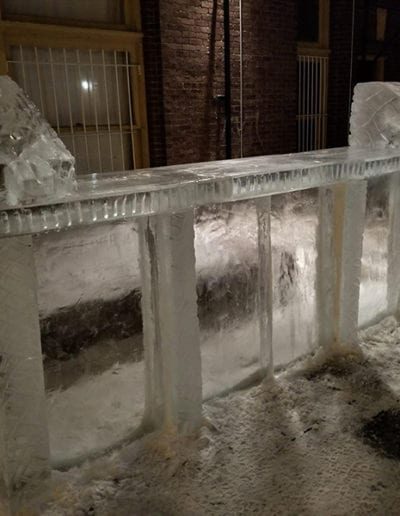 Ice luge sculptures on a bar